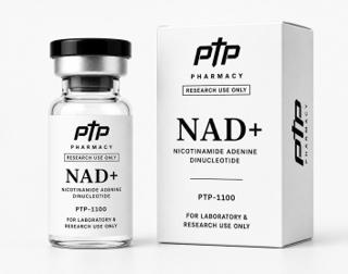 A clear borosilicate vial of NAD+ beside its white carton, both printed with the PTP Pharmacy mark, the research-use-only statement, the compound name and the catalogue number PTP-1100