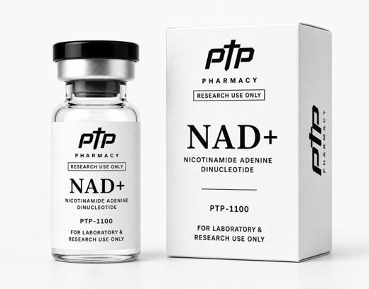 A clear borosilicate vial of NAD+ beside its white carton, both printed with the PTP Pharmacy mark, the research-use-only statement, the compound name and the catalogue number PTP-1100